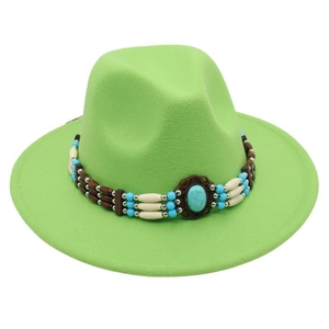 Detail of ethnic beaded band with turquoise stone on green felt fedora jazz hat