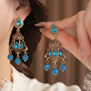 Vintage gold chandelier earrings with blue crystal drops and turquoise beads for women