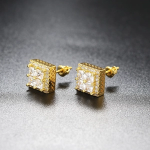 Macro detail of gold-plated square hip hop stud earrings with princess-cut cubic zirconia