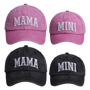 Matching Mama and Mini embroidered baseball caps in pink and charcoal washed cotton