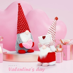 Close-up of Valentine's Day gnomes with plush hearts and love letters on a pink background