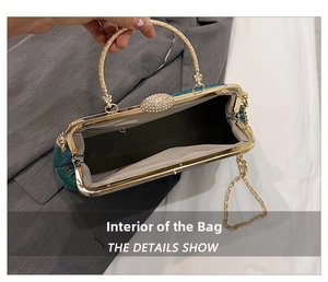 Detailed view of the peacock patterned evening bag with metal frame and chain strap