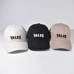 Cotton baseball cap set with TALES embroidery and distressed details in black white and khaki