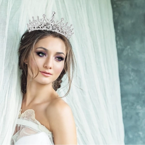 Elegant bridal crystal tiara crown for weddings or parties worn by a model
