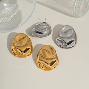 Modern 18K gold and silver geometric lava style stud earrings with a glossy finish