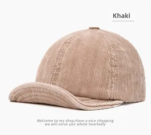 Close-up of the khaki corduroy fabric texture and stitching on the short-brim cap