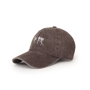 Detailed close-up of three white skull skeletons embroidery on washed charcoal baseball cap