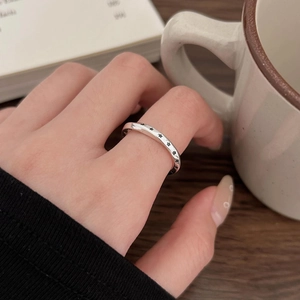 925 sterling silver vintage star ring in a minimalist lifestyle setting on a finger