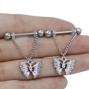 Pink butterfly nipple rings with silver rods and sparkling zircons held in hand