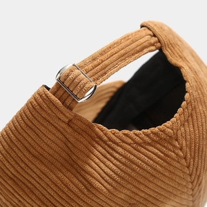 Detail view of brown corduroy baseball cap with adjustable metal slider buckle
