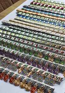 Detailed close-up of DIY Italian charm bracelet links in stainless steel with colorful charms