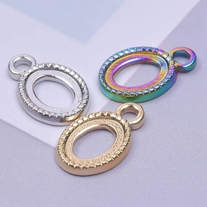 Textured oval stainless steel pendants in silver, gold, and iridescent finishes