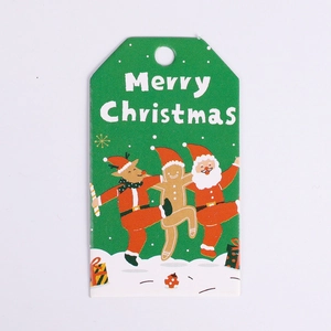 Green Christmas gift tag featuring Santa, gingerbread man, and reindeer illustration
