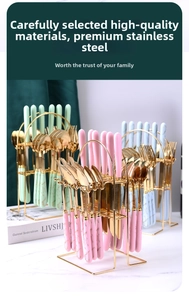 Detail of stainless steel cutlery set with marble texture handles in a gold storage rack