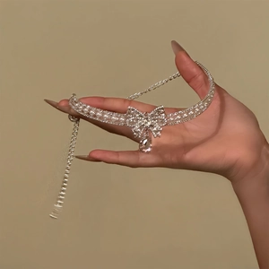 Elegant bow choker with faux pearls and teardrop crystal pendant in silver finish