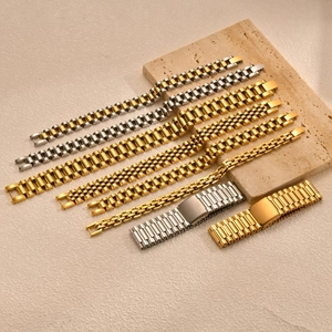 Detail view of various stainless steel watch-style bracelets in gold and silver finishes