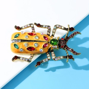 Vintage enamel beetle brooch with colorful rhinestones on bronze metal base