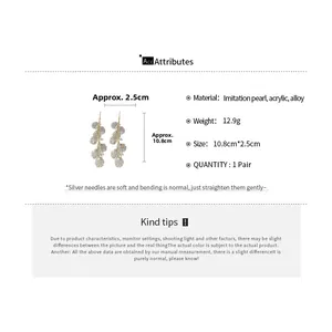 Detailed size specifications for faux shell tassel earrings with pearls and gold alloy