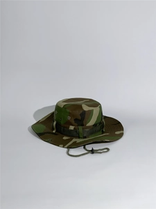 Detail of outdoor jungle camo bucket hat with metal eyelets and adjustable chin cord