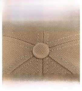 Macro view of the khaki baseball cap crown featuring reinforced stitching and button detail