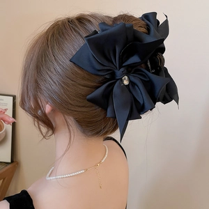 Elegant large black satin bow hair claw with teardrop crystal for French style updo