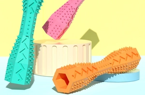 Detail of durable hexagonal pet chew toy with textured cleaning bumps in pastel colors