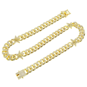 Hip hop gold Cuban link necklace with iced out stars and shimmering crystals on white background