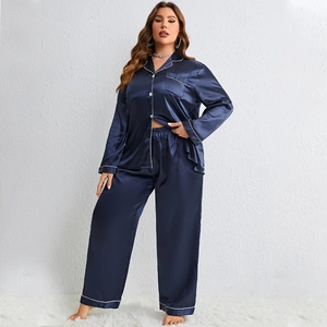Women's dark blue silk-like satin pajama set featuring long-sleeved top and pants