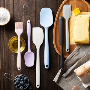 6-piece colorful silicone spatula set on wooden table with baking ingredients