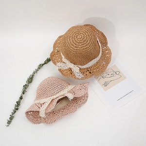 Kids handwoven straw sun hats with white lace bow tie and elegant wavy edge detail