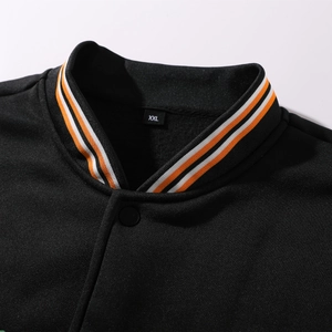 Close-up of black baseball jacket collar with orange and white striped rib knit