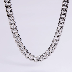 Close-up of polished stainless steel Cuban link necklace with flat interlocking chain links