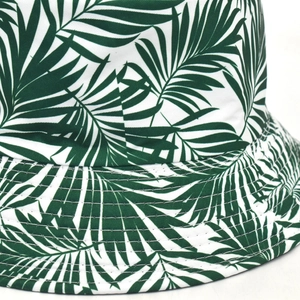 Detail of tropical palm leaf print on bucket hat with reinforced brim stitching