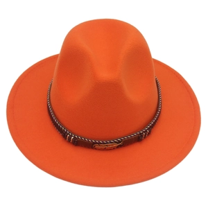 Detail of orange wide brim fedora hat featuring brown woven band and gold feather buckle