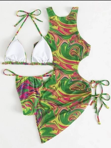 Detail of three-piece bikini set with lime green and pink psychedelic swirl pattern