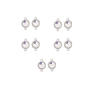 Macro detail of silver evil eye jewelry connectors with rhinestone pavé and dual rings