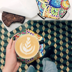 DIY diamond art coaster showing colorful hexagonal wood patterns with sparkling beads