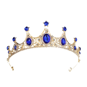 Vintage golden bridal tiara featuring deep blue gemstones and intricate cutout patterns
