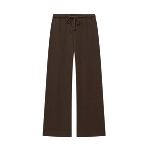 Detail view of dark brown high-waisted sweatpants with drawstring and soft knit texture