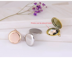 Detailed view of openable heart locket pendants in gold, silver, and rose gold finishes
