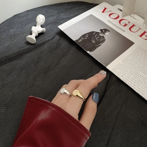 Polished S925 sterling silver minimalist geometric rings worn by a model in a fashion setting