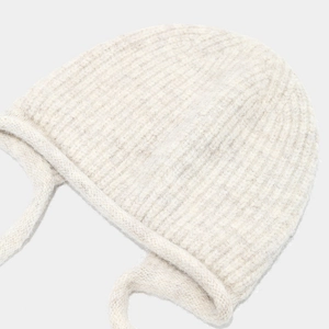 Chic cream white cable knit wool beanie with ear flaps and soft braided ties for women