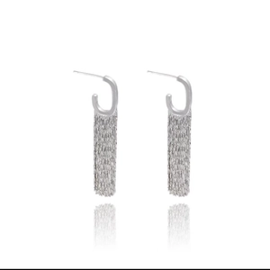 Detailed view of silver tassel drop earrings with long metal chains on white background