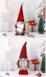 Detail of Christmas gnomes with broom and long beard on festive holiday background