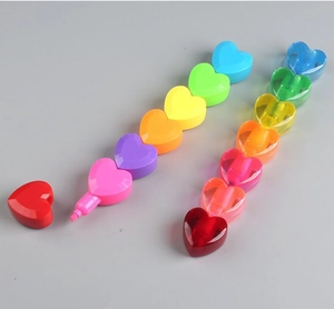 Macro shot of heart-shaped highlighter pens in solid and clear rainbow colors
