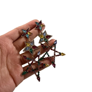Elegant gold star drop earrings featuring colorful rhinestones in a tiered star design