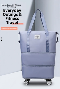 Detail of expandable lavender travel bag with wheels and waterproof fabric texture