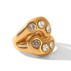 Close-up of irregular wave ring in 18k gold-plated steel with six inset zircons