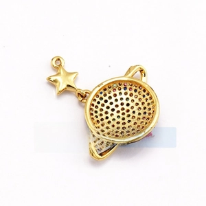 Detailed back view of gold planet and star pendant with colorful pavé set crystals