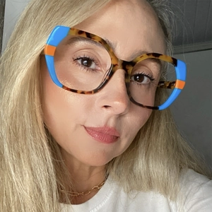 Detailed close-up of stylish TR90 cat-eye blue light blocking glasses on a female model